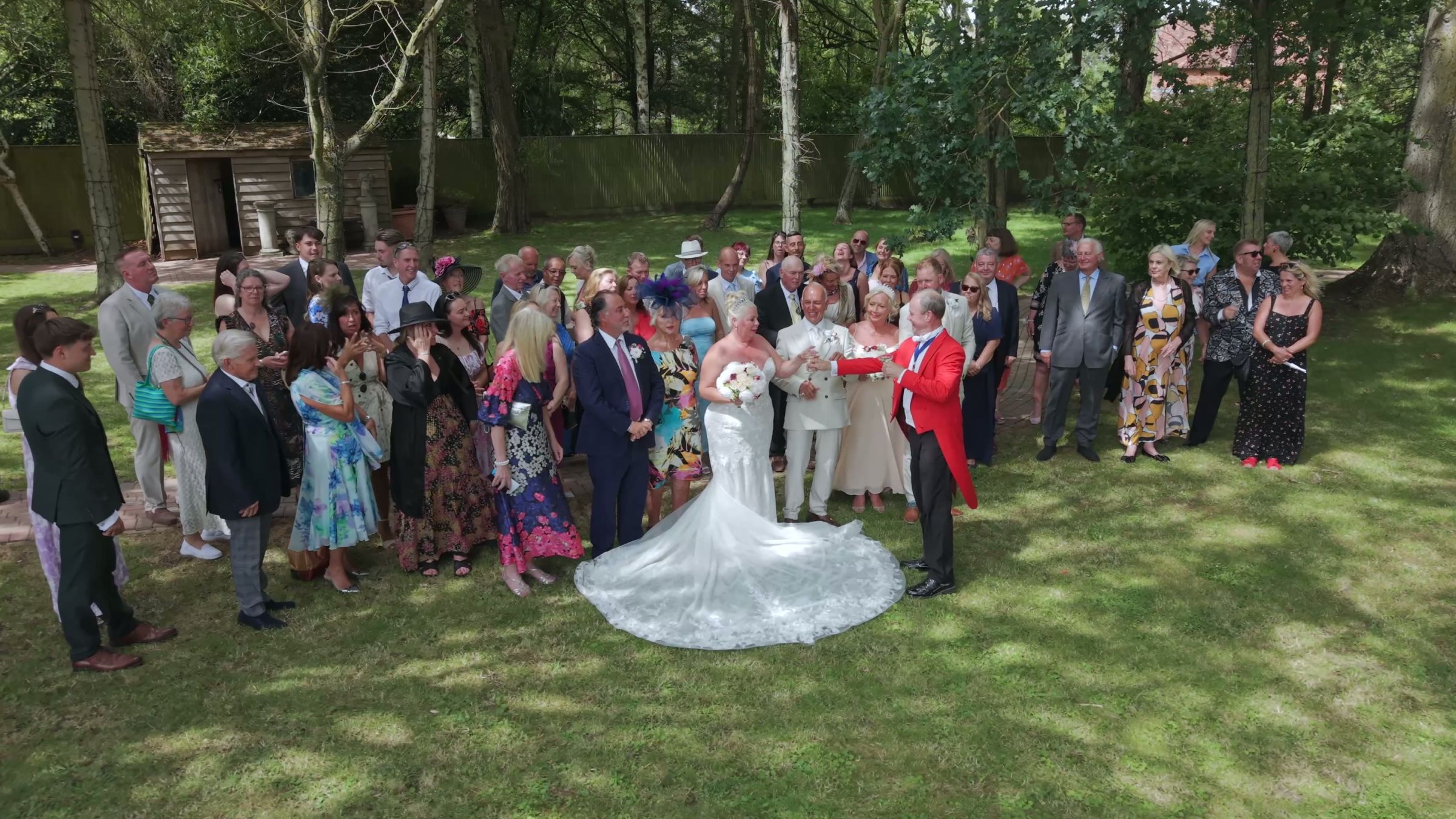 A toastmaster introducing a newlywed couple to the congregated guests.